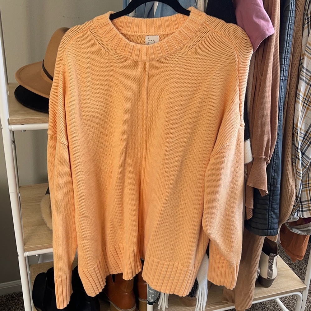 Light orange sweater
